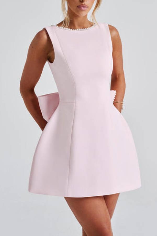 Lillian® | Stylish slim-fit mini dress with a large bow and beaded detailing